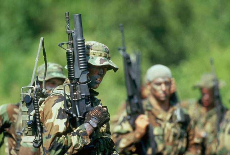 Navy SEALs holding M203 grenade launchers