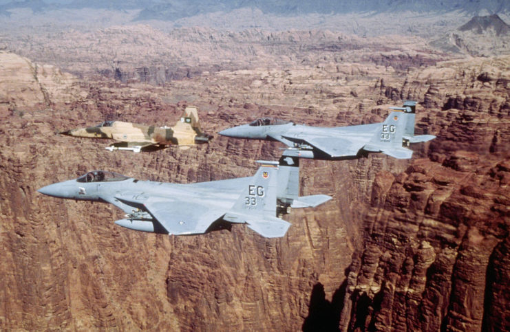 Two USAF F-15C Eagle fighters and one Royal Saudi Air Force F-5E Tiger II fighter in flight