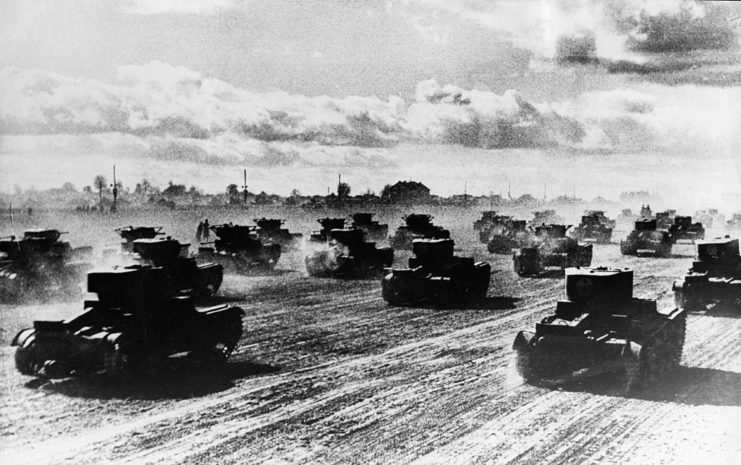 Russian tanks driving across a road