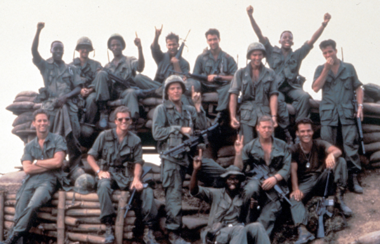 Cast of 'Hamburger Hill' sitting together