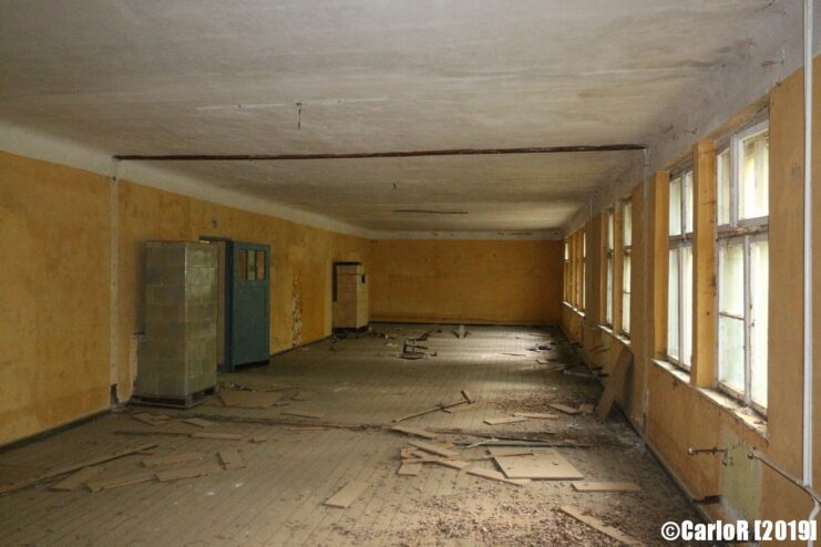 Debris strewn across the floor of a large room