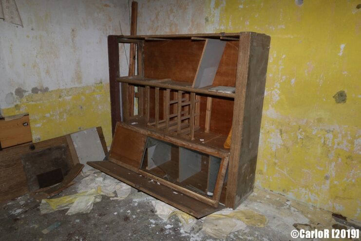 Wooden bookshelf in the corner of a room