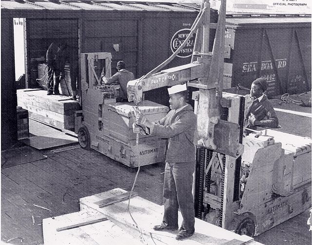 African-American sailors working with equipment on the Port Chicago Pier