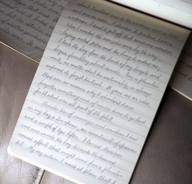 Open notebook with handwriting on the inside